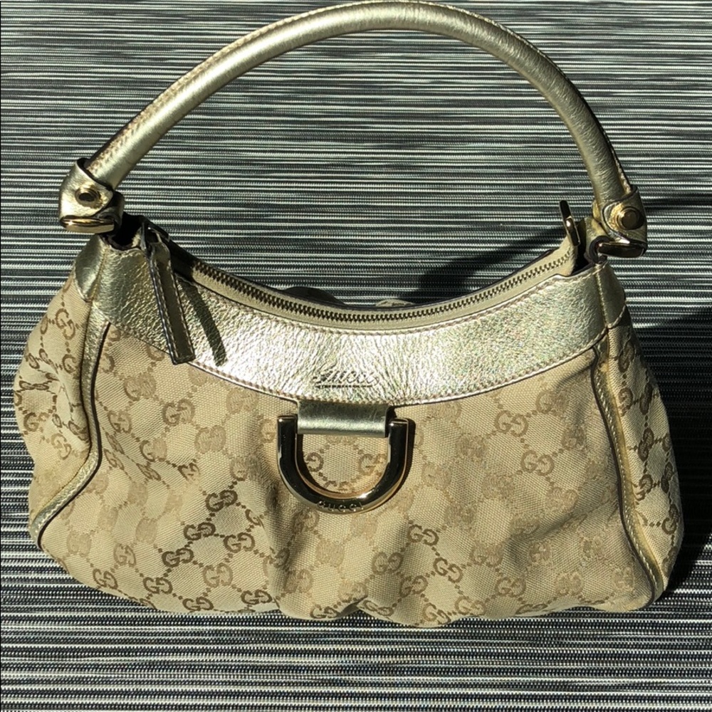 Authentic Gucci "GG" canvas D Gold hobo handbag